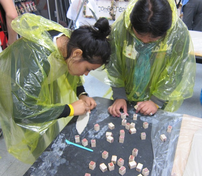 Participants making tiles