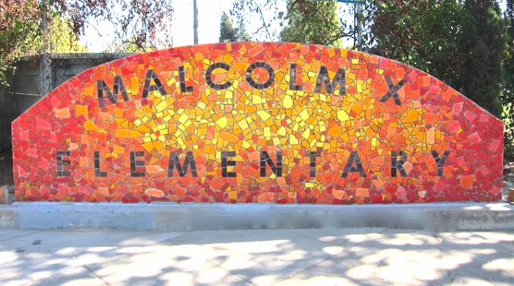 Malcolm X Elementary sign, community project, 15'w x 5'h 