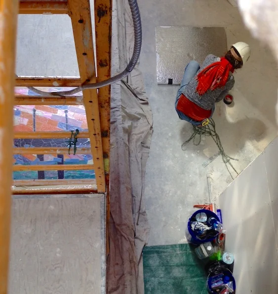Getting ready to take up the mosaic sections, two at a time, sandwiched between foam.