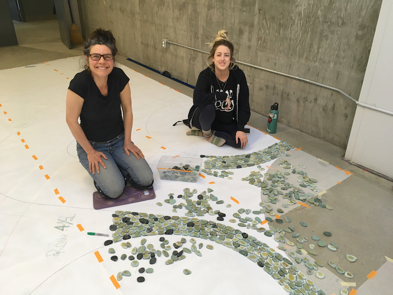 Sophia Othman and Angelina Duckett laying the first pebbles