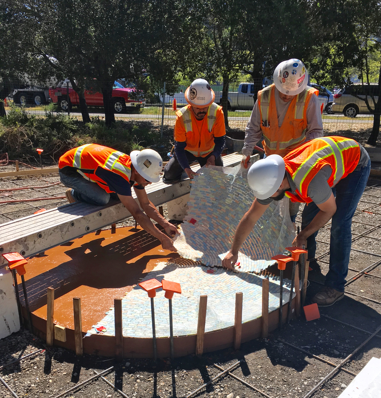 TB Penick's team laying the mosaic sections in face down