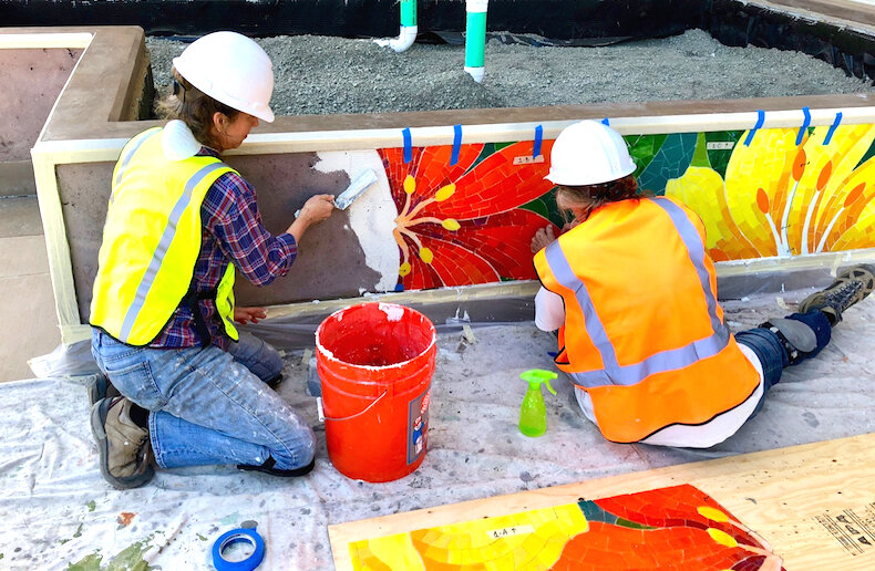 Rachel Rodi and Kim Payne installing the mosaic