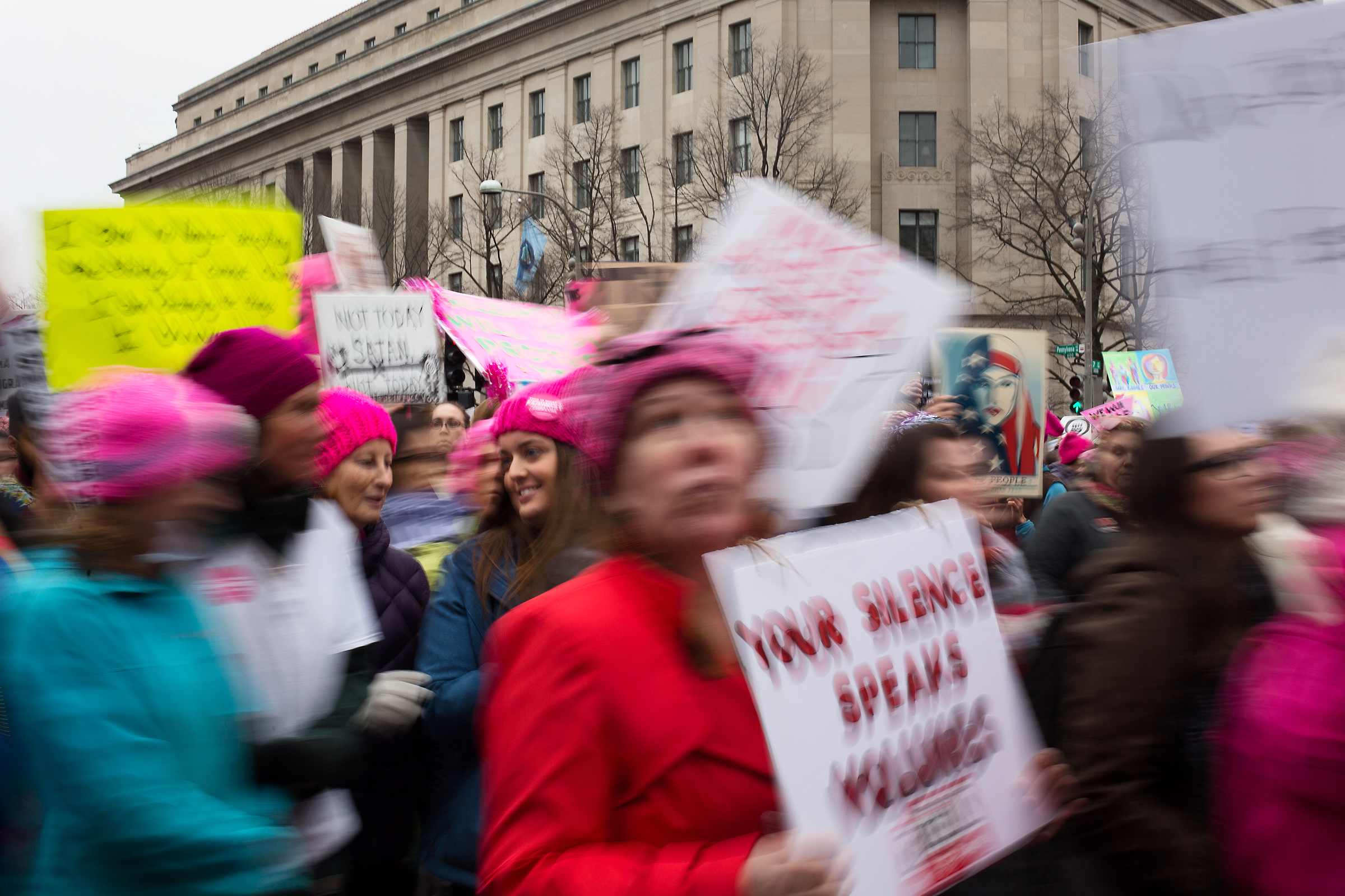 A girl turns to speak to a friend during the 2017 Women's March along Pennsylvania Avenue in Washington D.C. on Jan. 21, 2017.