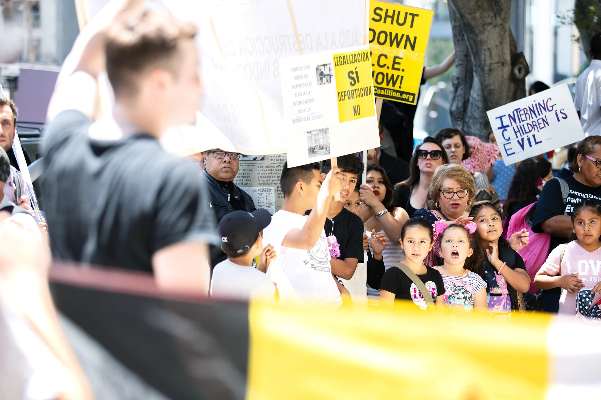 Families protest Attorney General Jeff Sessions’ Los Angeles visit by chanting in front of the Millennium Biltmore Hotel, where he held a meeting on June 26, 2018.