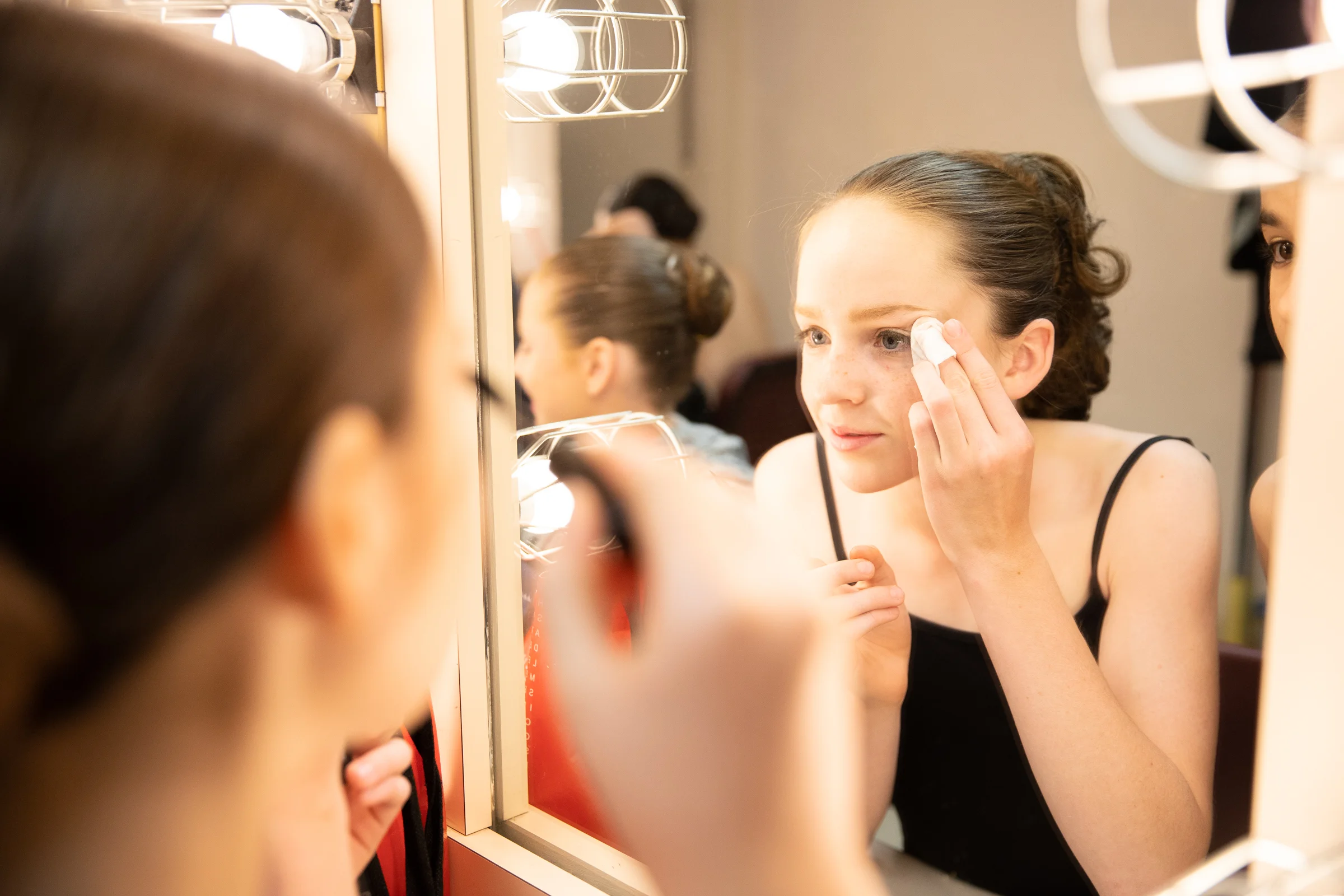 Polina Bortok applies her makeup backstage before Western Ballet's production of "The Nutcracker" at the Mountain View Center for the Performing Arts on Dec. 2, 2018.