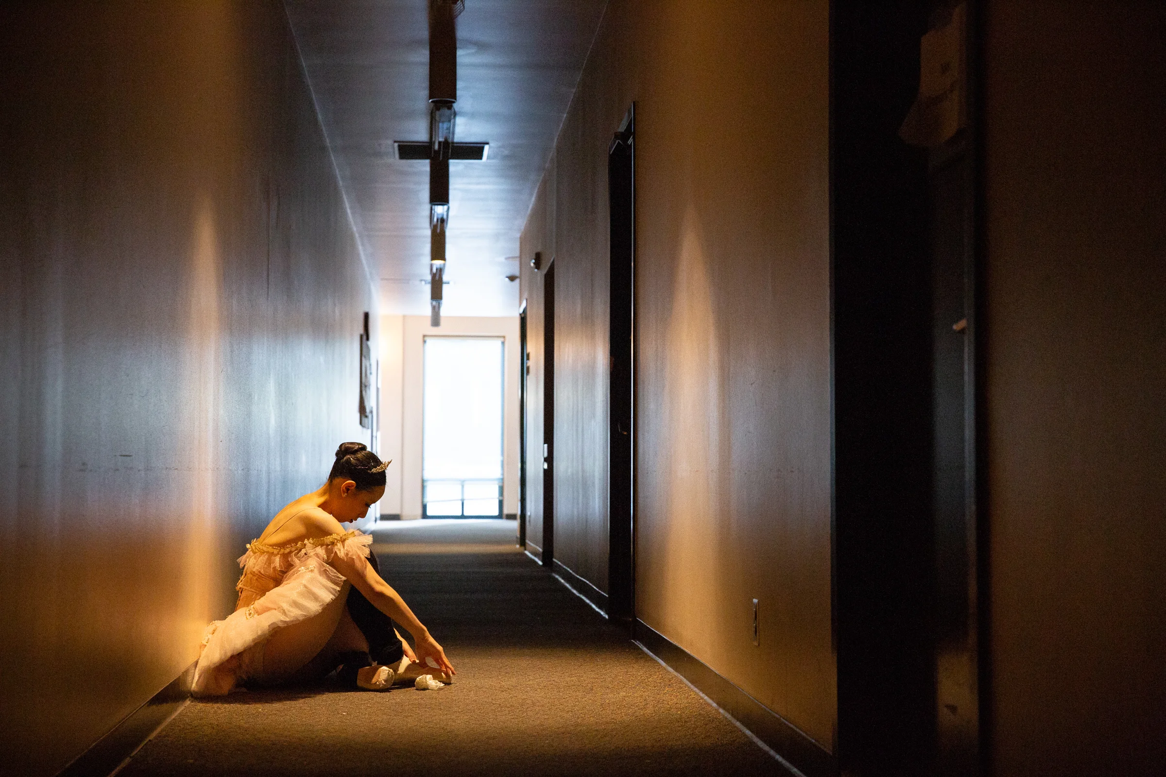 Assistant Artistic Director Alison Share, who plays the Sugar Plum Fairy, adjusts her pointe shoes backstage at Western Ballet's production of "The Nutcracker" at the Mountain View Center for the Performing Arts on Dec. 2, 2018.
