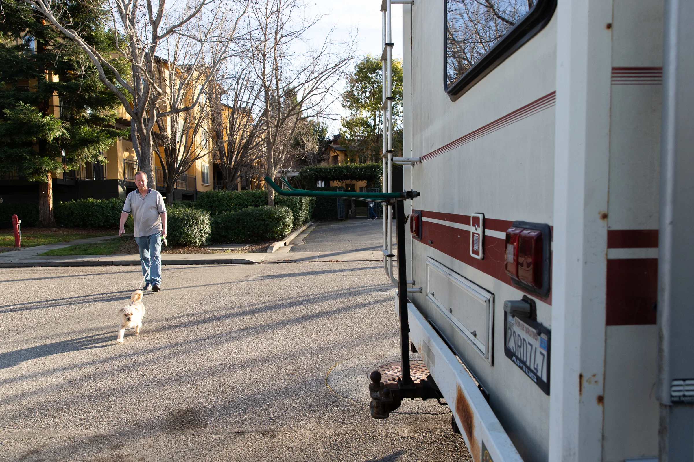 Scott Rodvold walks Winnie by the apartment he used to live in in Mountain View, California, on March 8.