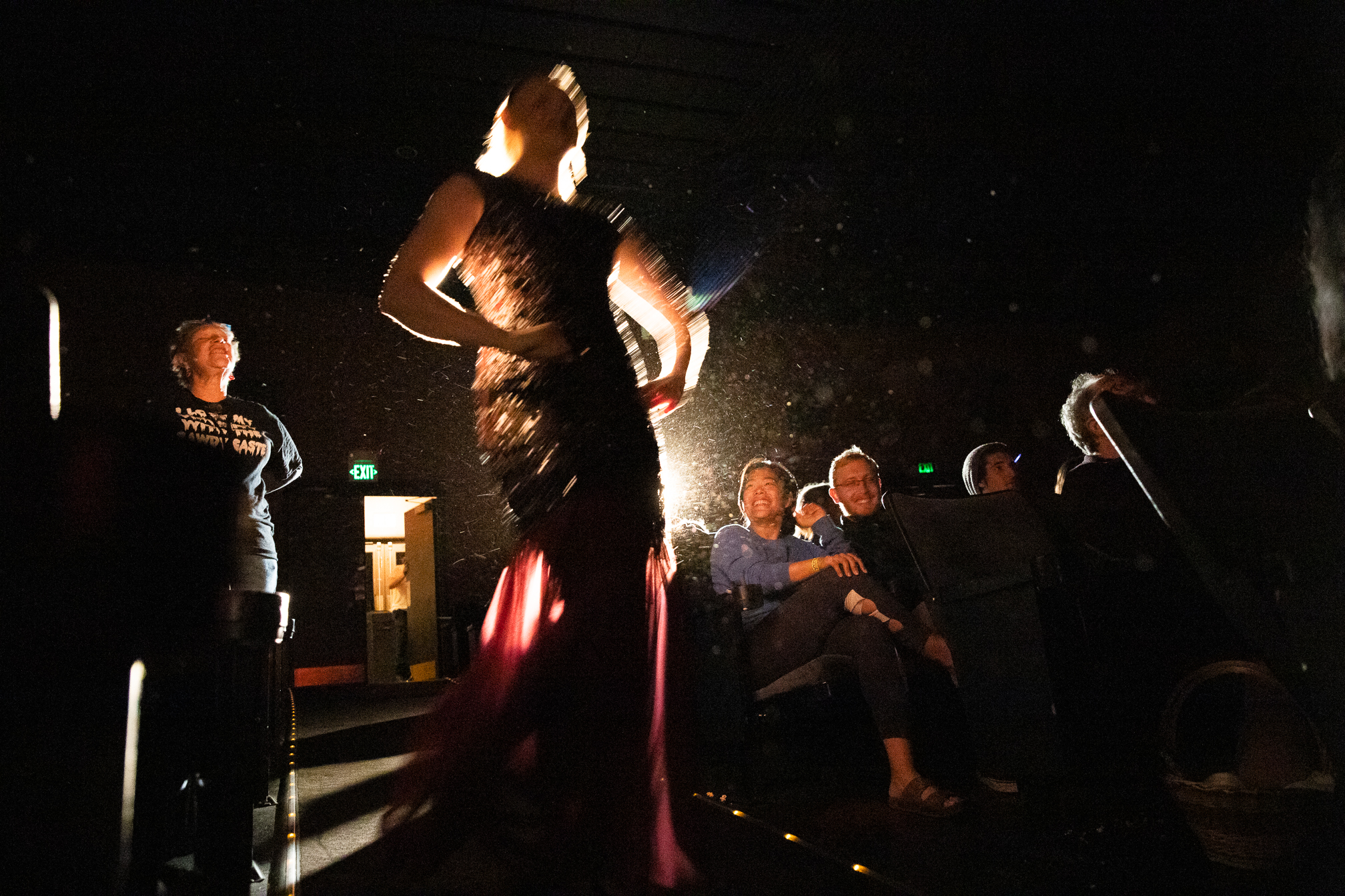 Katie Martin, who is playing Trixie, struts past smiling audience members while a Bawdy Caste crew member heckles her. Yelling call-back lines, as the Rocky community calls them, at the screen and the actors is a normal part of Rocky culture. “It’s part of the universal aspect of ‘Rocky Horror Picture Show’ — people all over the world getting together to yell stuff at a screen,” said Michael Delfino, a Bawdy Caste member. “Without the audience, yelling their call-back lines, the cultural phenomenon that is ‘The Rocky Horror Picture Show’ would not exist.”