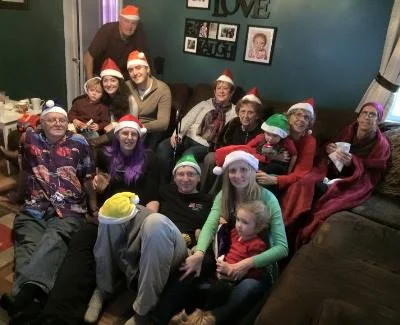 My Aunt Claire, top right corner, and the rest of the Burns-Thompson side of my family celebrate Christmas in 2014. (photo from my cousin Molly although she's in it so I have no idea who took it.)