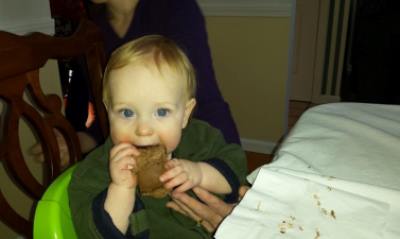 My son Reid, two-fisting his 1st Birthday cake like a champ.
