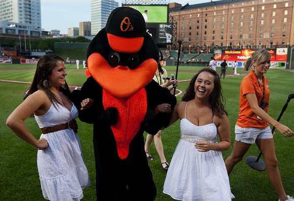 The Oriole Bird, pictured with his child brides, I guess. (pennlive.com)