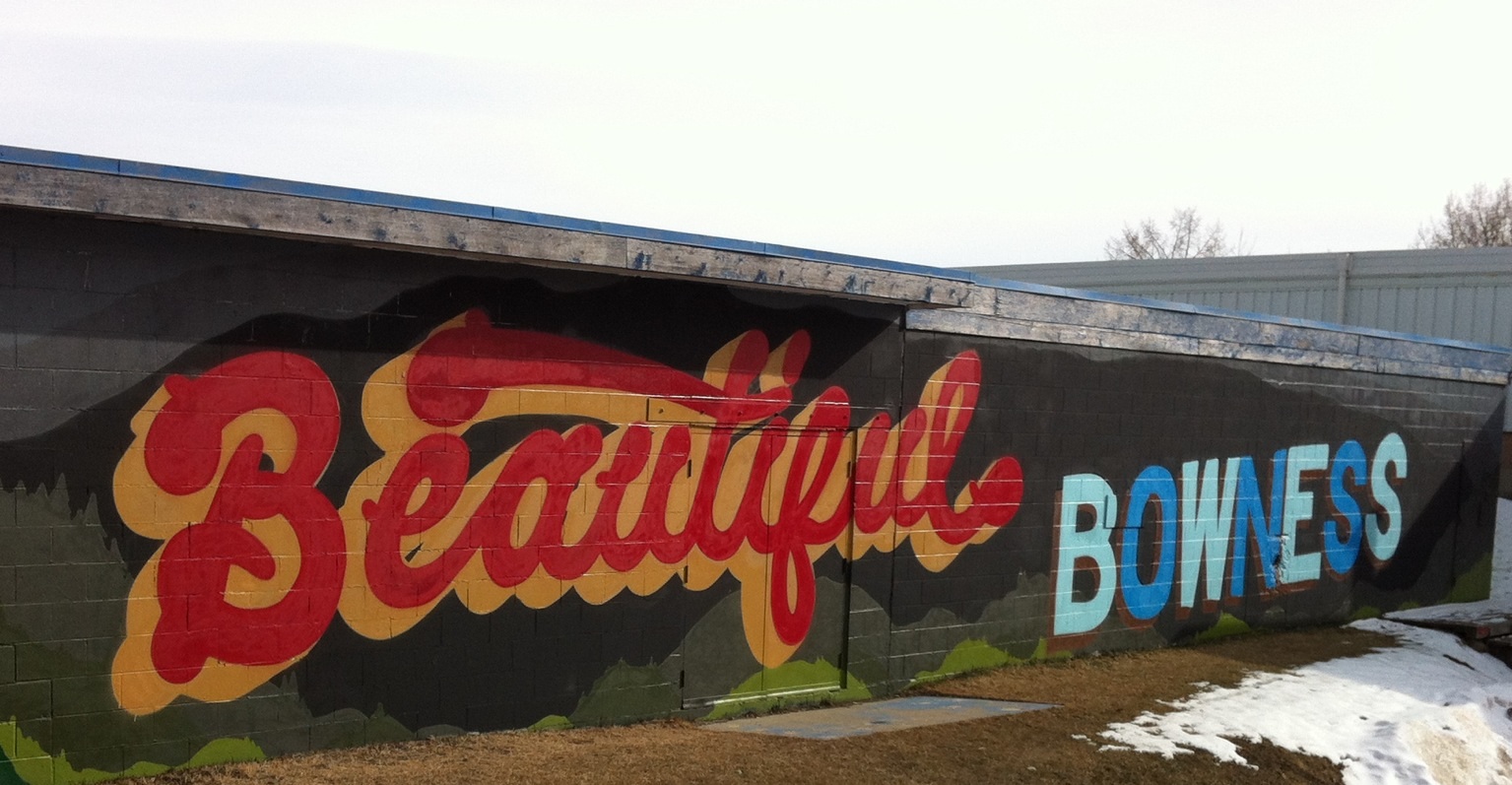 Beautiful Bowness mural on the side of an auxiliary building next to arena. Great community pride!