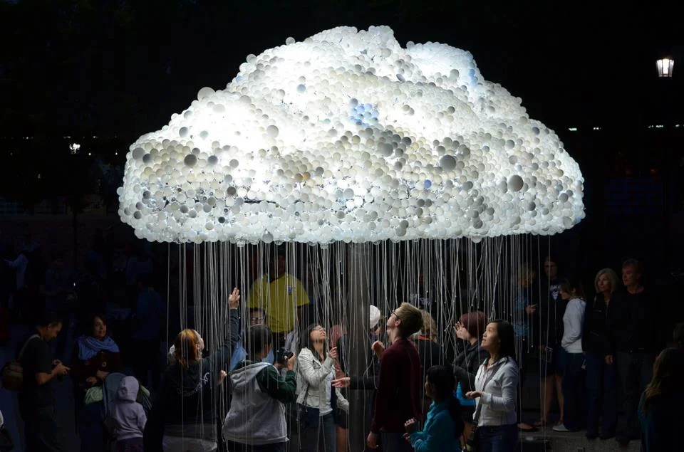 The "Cloud" is an interactive art installation by artist Caitlind r.c. Brown that was unveiled at Nuit Blanche September 15th 2012 on Calgary's Olympic Plaza. The artwork is made of 1000 working light bulbs with pull chains and 5000 burt- out light bulbs donated by public. Visitors independently pull the chains to turn the light bulbs on and off which result in a shimmering effect. While I was there, the public all got together to turn off all the light bulbs and then at a count of 3 they pulled the chains all the lights came on at once. You gotta like public art that is fun.