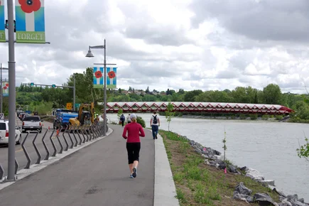 Another view of the Peace Bridge and how it links to the pathway on the north side of the Bow River. It is all part of the Downtown Bow River pedestrian experience. A second iconic pedestrian bridge is currently under construction at the east end of the Downtown to create a circular urban walking path. 