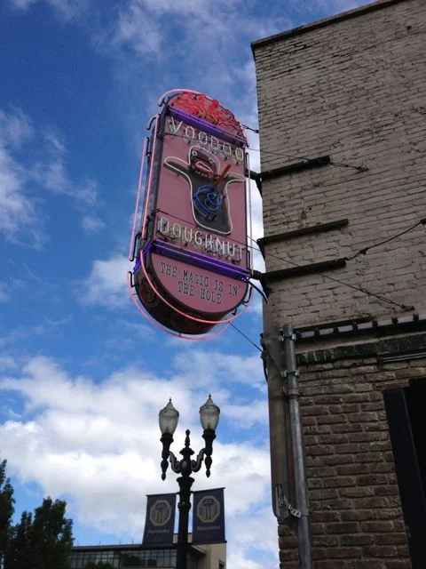 This unassuming sign and building is home to one of Portland's biggest tourist attractions Voodoo Doughnut. They say the magic is in the hole but from what we saw it wasn't the hole people were buying. 