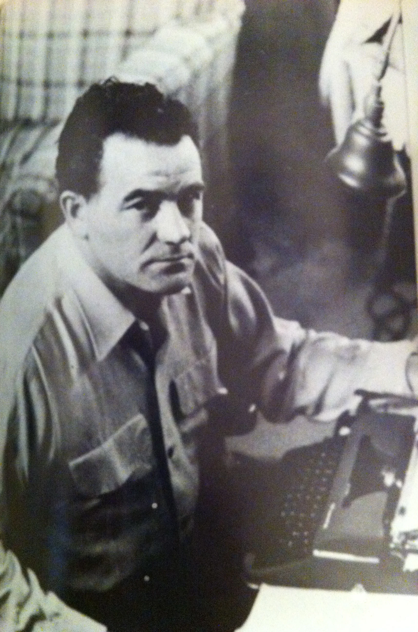 Artist at typewriter in Los Angeles apartment 1953