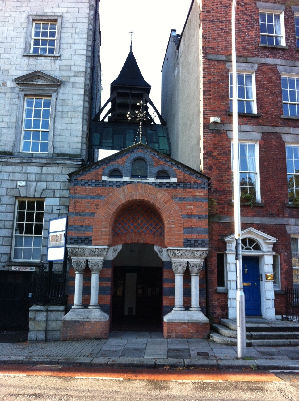 It is easy to miss the Church's narrow street entrance