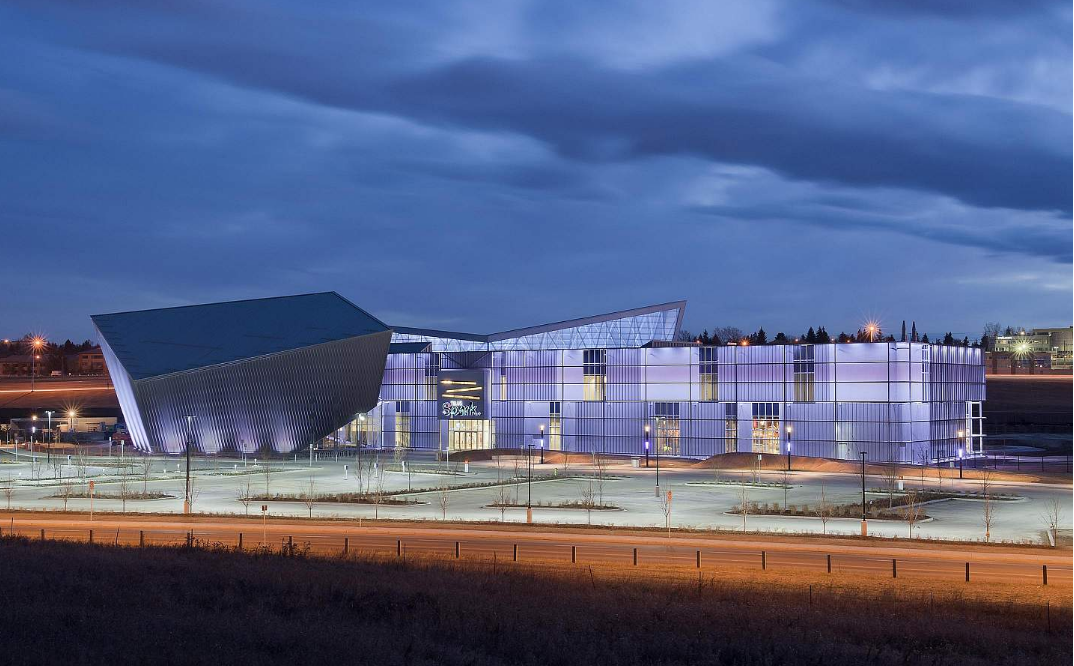 TELUS Spark's facade is grey by day, but at night it comes alive with a multi-colour light show. (photo credit: DIALOG Design)