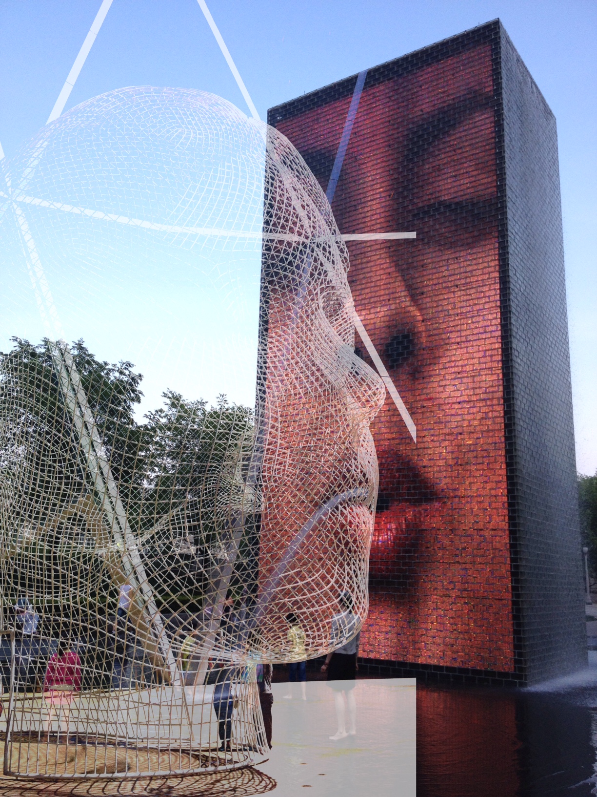 Jaume Plensa's "Crown Fountain" from Chicago's Millennium Park meets "Wonderland" his public artwork on the plaza in front of Calgary's Bow Tower. 