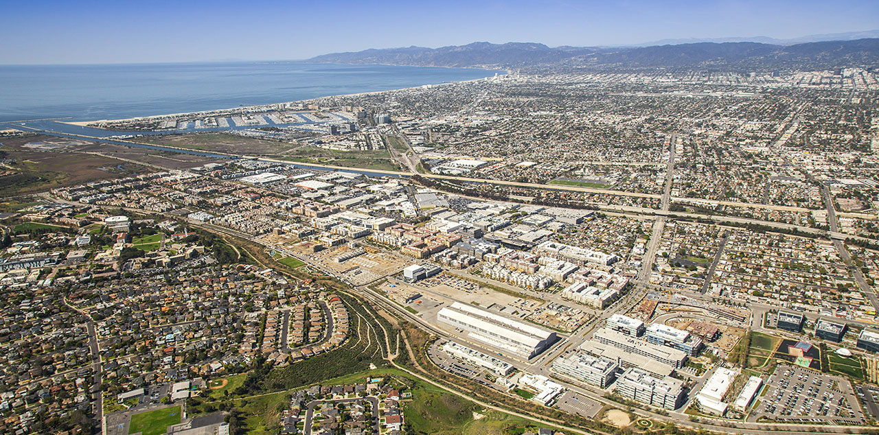 LA doesn't have the amount of vacant land that Calgary does, but one interesting large-scale land development is Playa Vista, developed on the former site of Howard Hughes Airport (the project was bought by Calgary's Brookfield Residential). A master planned community, it has been developing over time since 2002, demonstrating that a long-term commitment and phased build-out can create exceptional long-term value (as opposed to trying to build the entire community as quickly as possible, and claiming there is no market for density). This allows the developer to build at higher densities than a shorter build out would allow (since the market would not be there for higher densities). It's organized into blocks, with an emphasis on a high quality public realm, with one-third of the area set aside as a wetland preserve. It has a range of architecture, from traditional to contemporary and a mix of apartments, single family, retail, and office -- a genuine complete community. It's also an ethnically diverse community. Its amenities has attracted several tech companies to locate there (Microsoft, Facebook, Electronic Arts, Belkin). This is the kind of complete community Calgary's new communities should aspire to.