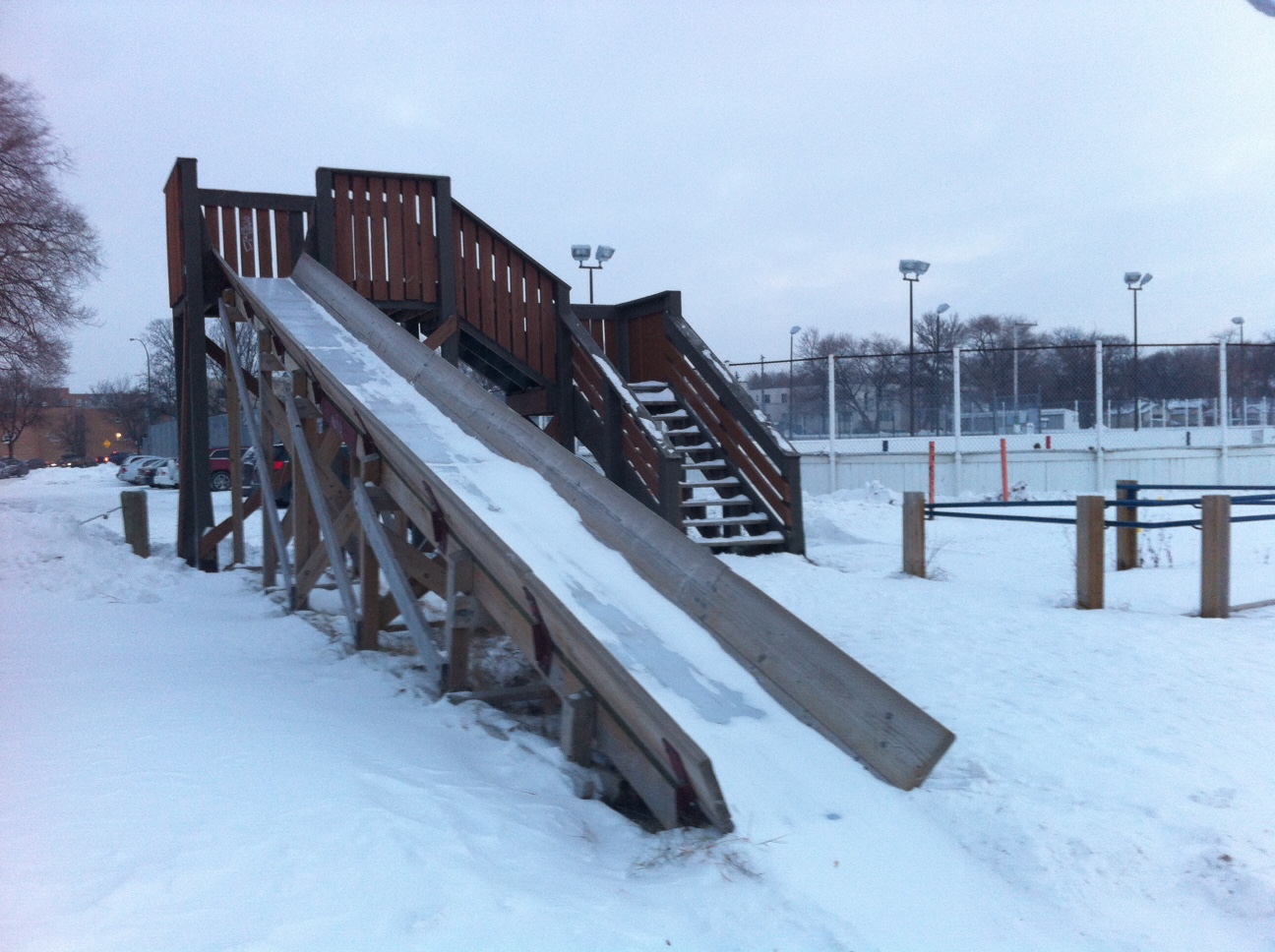 This snow slide in Winnipeg next to an old fashion outdoor hockey rink. I imagine it gets used by siblings who get tired of watching the good old hockey game. I don't recall seeing one of these in another park. 