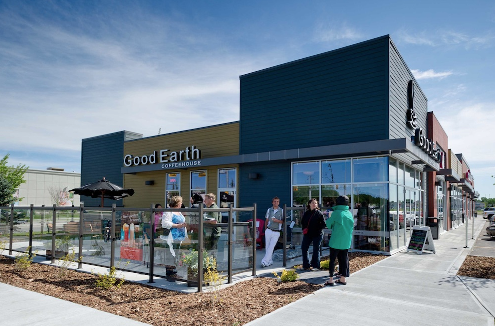 Good Earth Cafe and patio part of a car-oriented big box power centre, is also walkable from several major condo complexes a block away. 