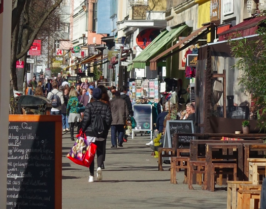 Bergmannstrabe is a just one of several pedestrian streets in Kreuzberg. There are no banners, hanging baskets, no designer street furniture or lighting. No need for patio fences just lots of shops, cafes and restaurants.