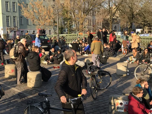 A small pedestrian bridge becomes an impromptu evening and weekend beer garden - no permit, no tables, sit anywhere, bring your guitar and just hang out.