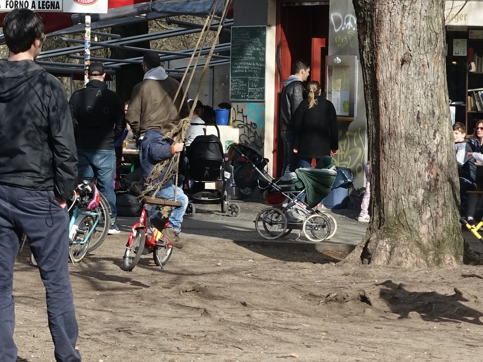 While not all of the streets in urban neighbourhoods are animated like this one, the sidewalks and parks often full of people of all ages hanging out. There is not much grass in the public spaces as they are so heavily used. 