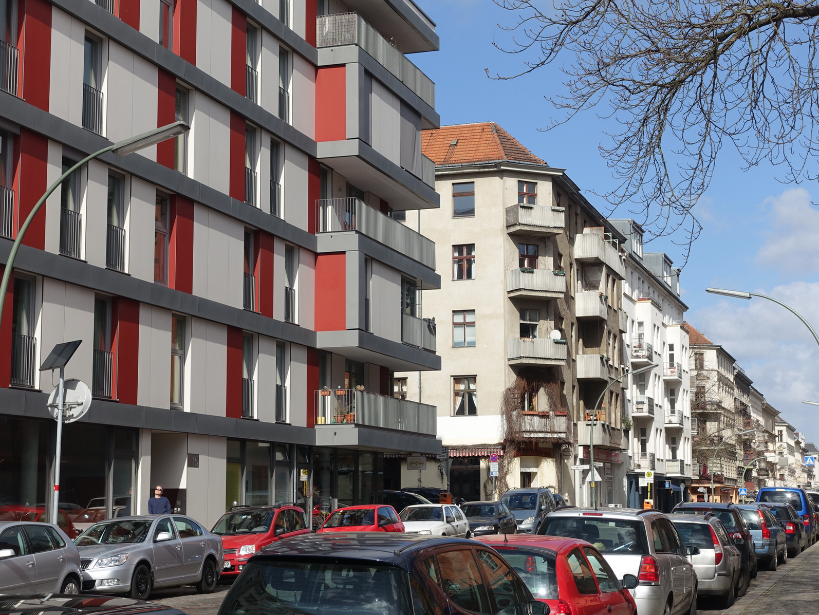 While fewer people own cars, the streets are still lined with cars as their is little to no underground parking for residents, retail or restaurants. There are no fancy curbs, bike lanes, crosswalks, speed bumps - they just make it work. 