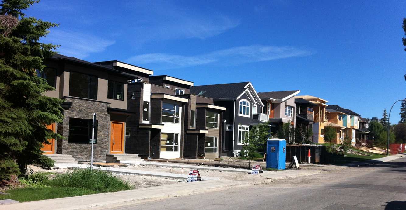 This is a street in Calgary's Hillhurst community, it looked like a suburban parade of show homes when I took the photo a few years ago. These homes are very popular with young families, which helps to revitalize established communities, creating a healthy inner-city. Today, even in a recession there are new infill homes being built on almost every other block in all established communities within 5 to 10 km of downtown. 