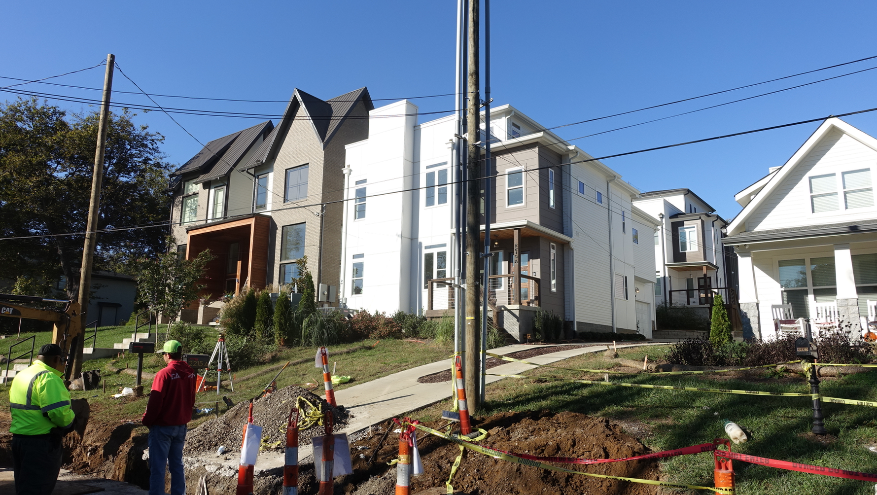 New homes at the front and at the back of the lot create four new homes on one large lot.