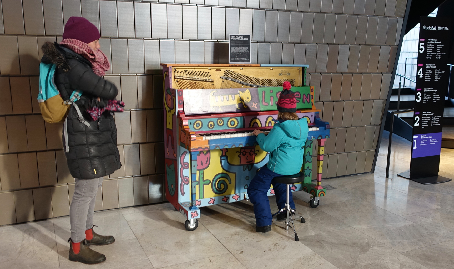 National Music Centre's lobby invites visitors to play pianos and guitars.