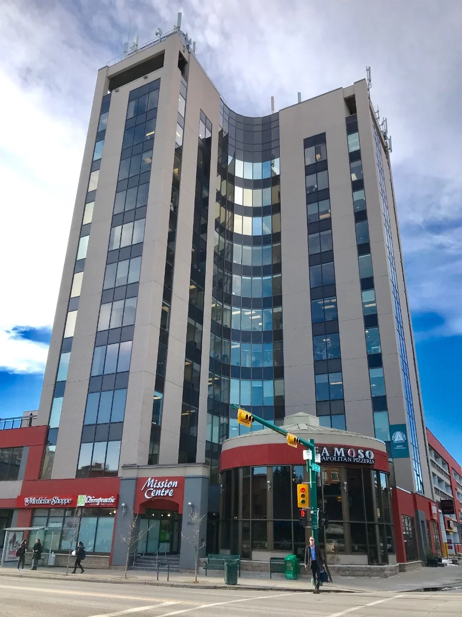 Built in 1973, the Mission Centre office building's curved architecture foreshadows that of the Bow Tower and has a better interface with the street. 