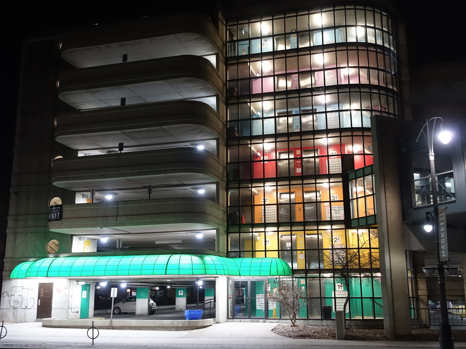 This brutalist parkade comes alive at night with light and colour. How simple, effective and affordable is that. 