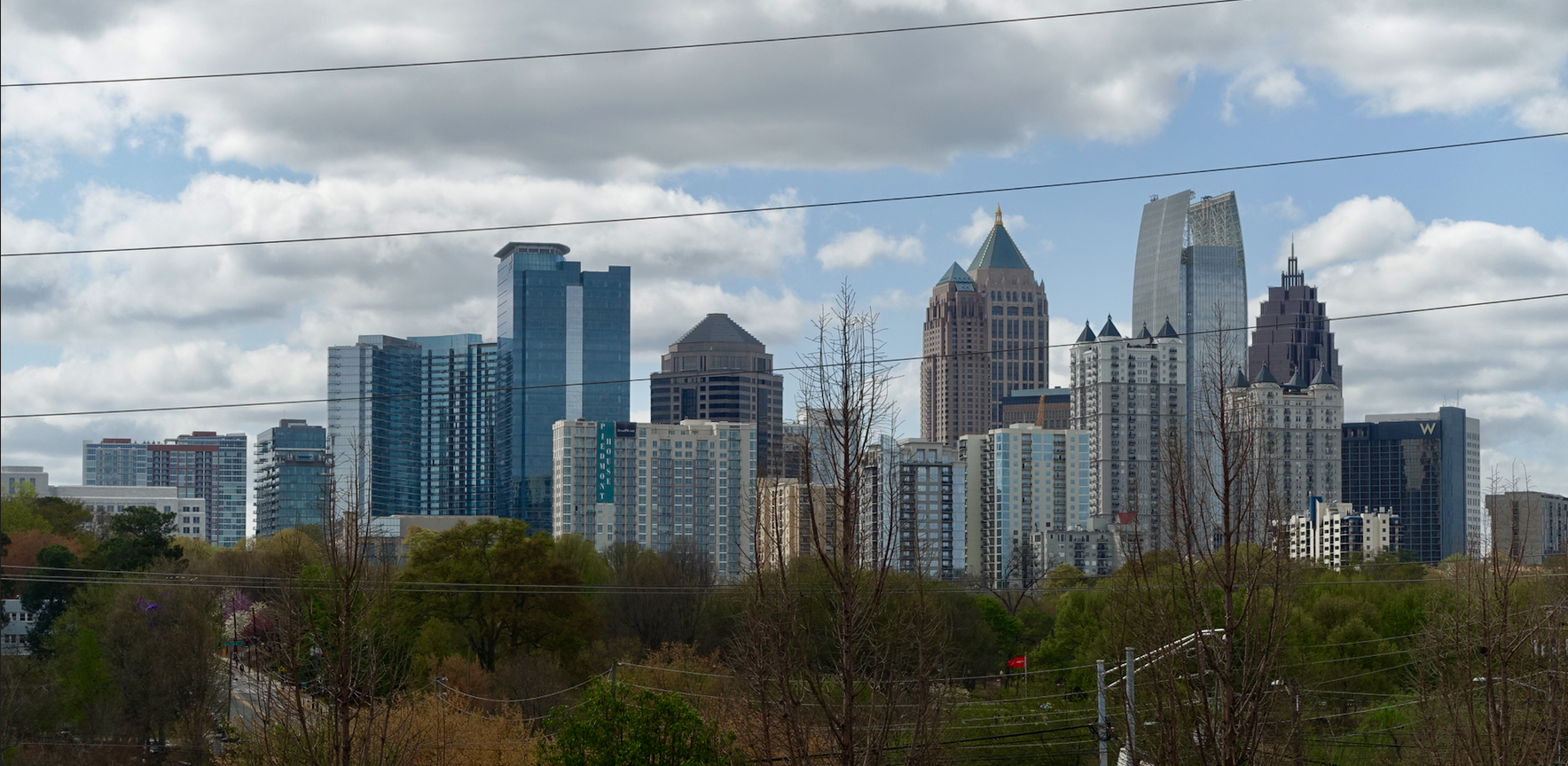 Atlanta's midtown skyline, with Piedmont Park in the foreground.