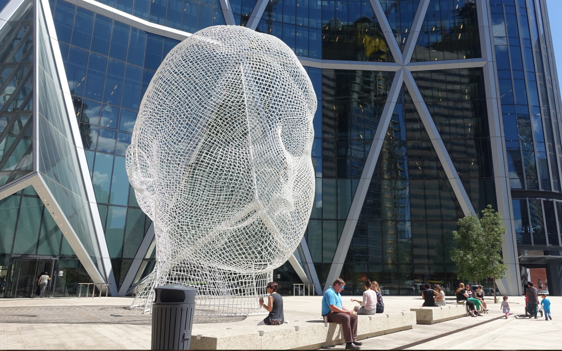 Calgary's, Wonderland, by Jaume Plensa on the plaza in front of the Bow office tower designed by Norman Foster. 
