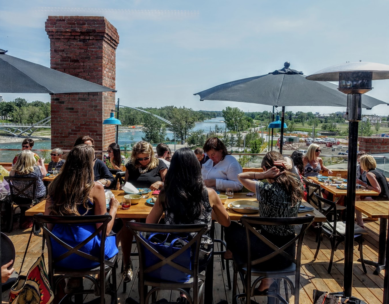 Roof-top dining on the Simons Building on the banks of the Bow River in East Village.