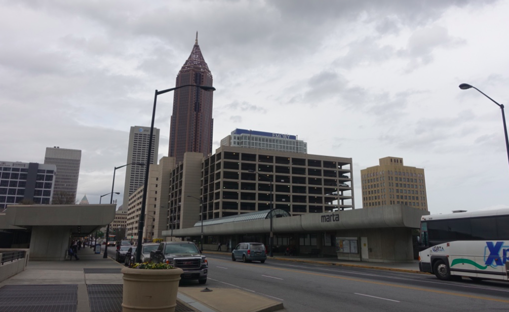 Altanta's MARTA subway stations are dark and dingy. Note the street is lined with above ground parkades vs Calgary's underground parkades. 
