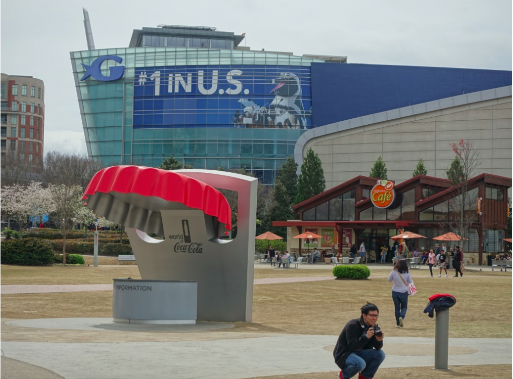 Gotta love the Coca-Cola sponsored funky information booth at Centennial Olympic Park, that looks like a Claes Oldenburg sculpture. Note the cafe and aquarium in the background. 
