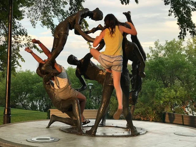 "Art imitates life" or is it the other way around. I love how these girls were inspired to climb and play with this piece by Saskatchewan artist William Epp titled "Tribute to Youth" created in 1989. Public art should engage the public. 