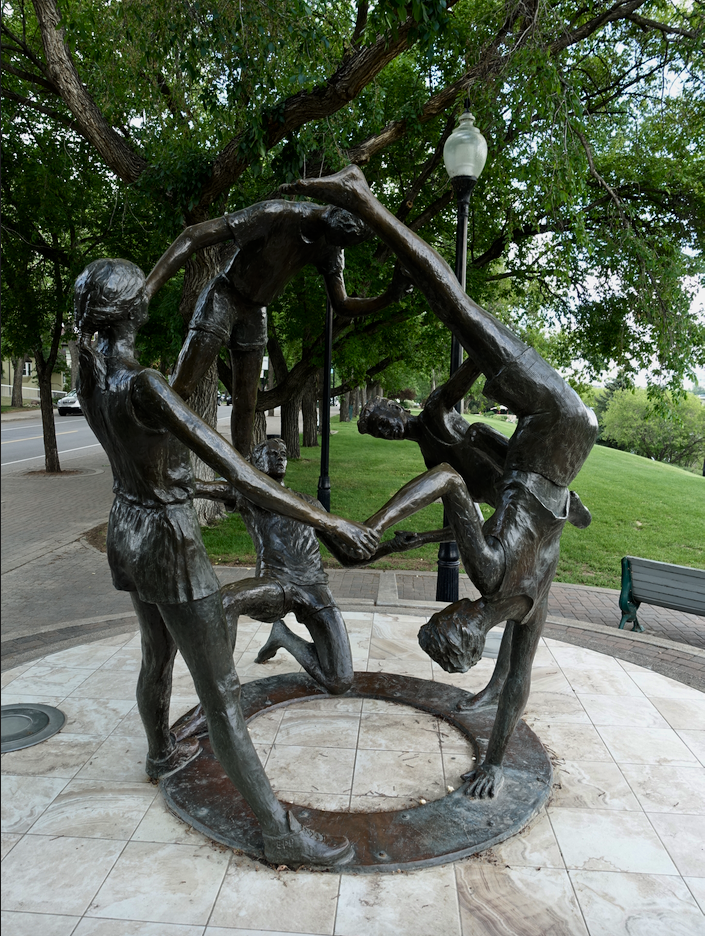 Bill Epp’s 1989 artwork title “Tribute to Youth” which Morris references reflects the Saskatoon’s sense of play and togetherness.