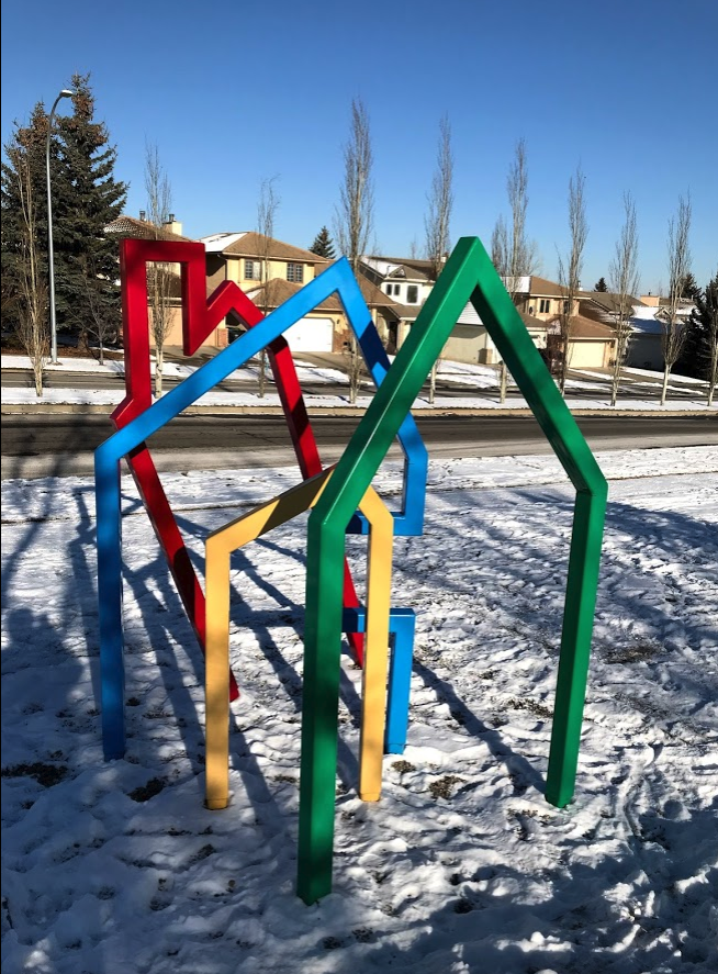 From this angle it looks like two adults, a child and a house.
