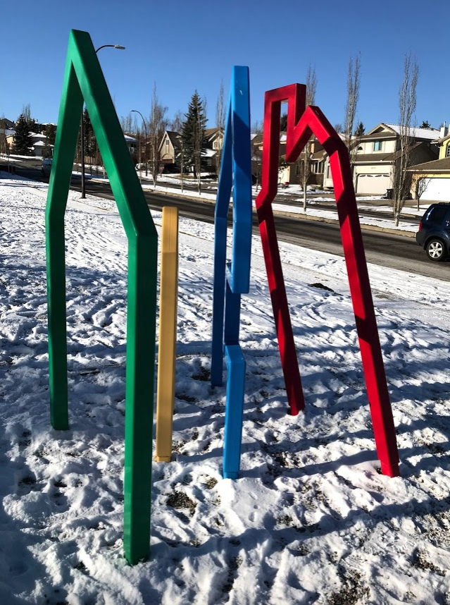 From this angle it looks more like parade or a group of figures walking together on a sidewalk .