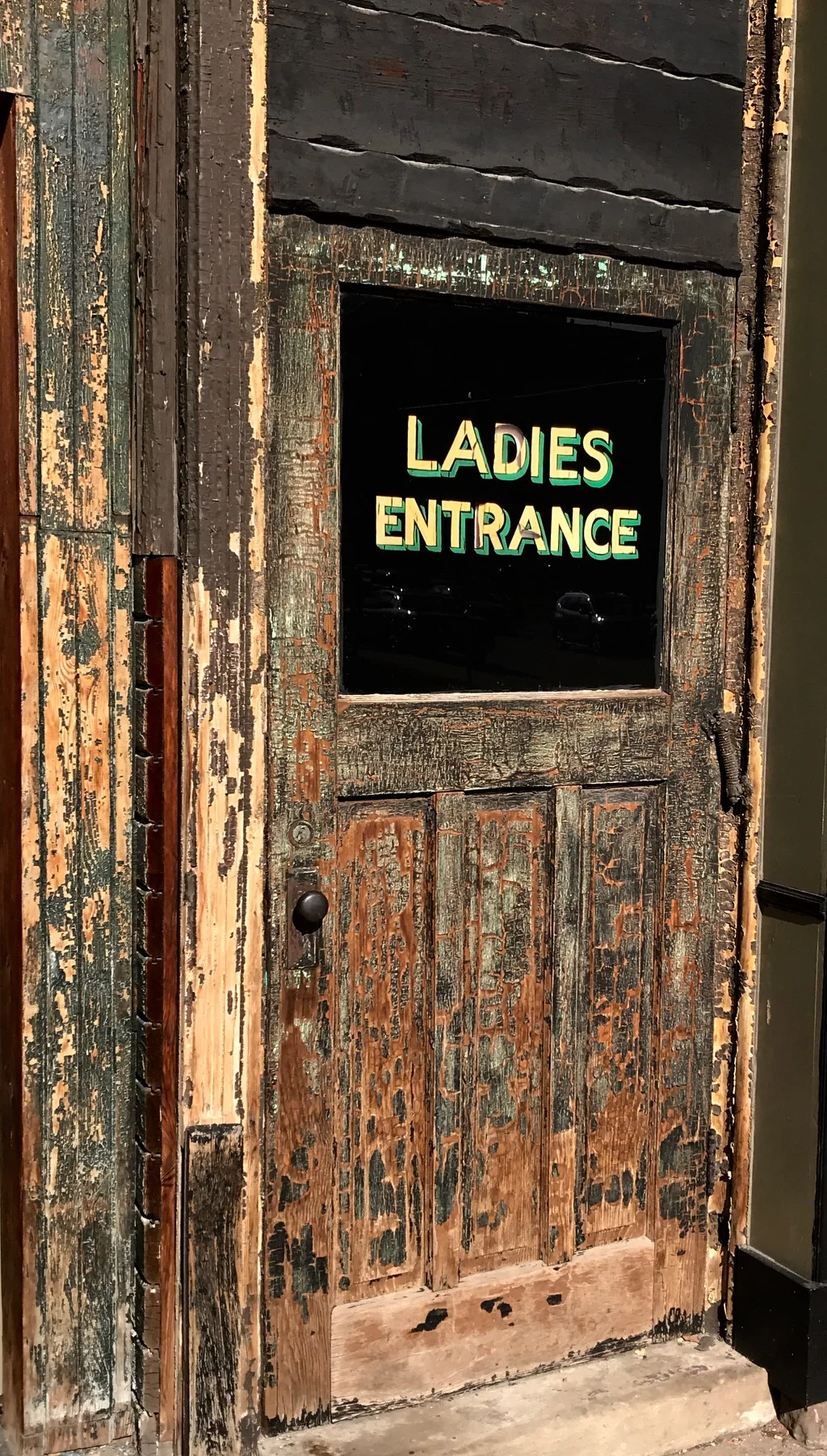 The patina and words on this door in Hamilton harkens back to a different time.