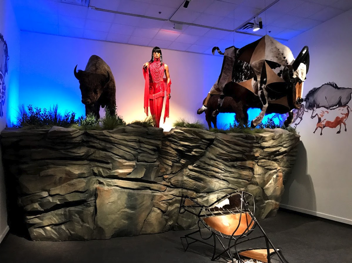 Kent Monkman’s installation titled, “The Rise and Fall of Civilization” with its three figures at the edge of a cliff makes multiple references to civilizations past and present.