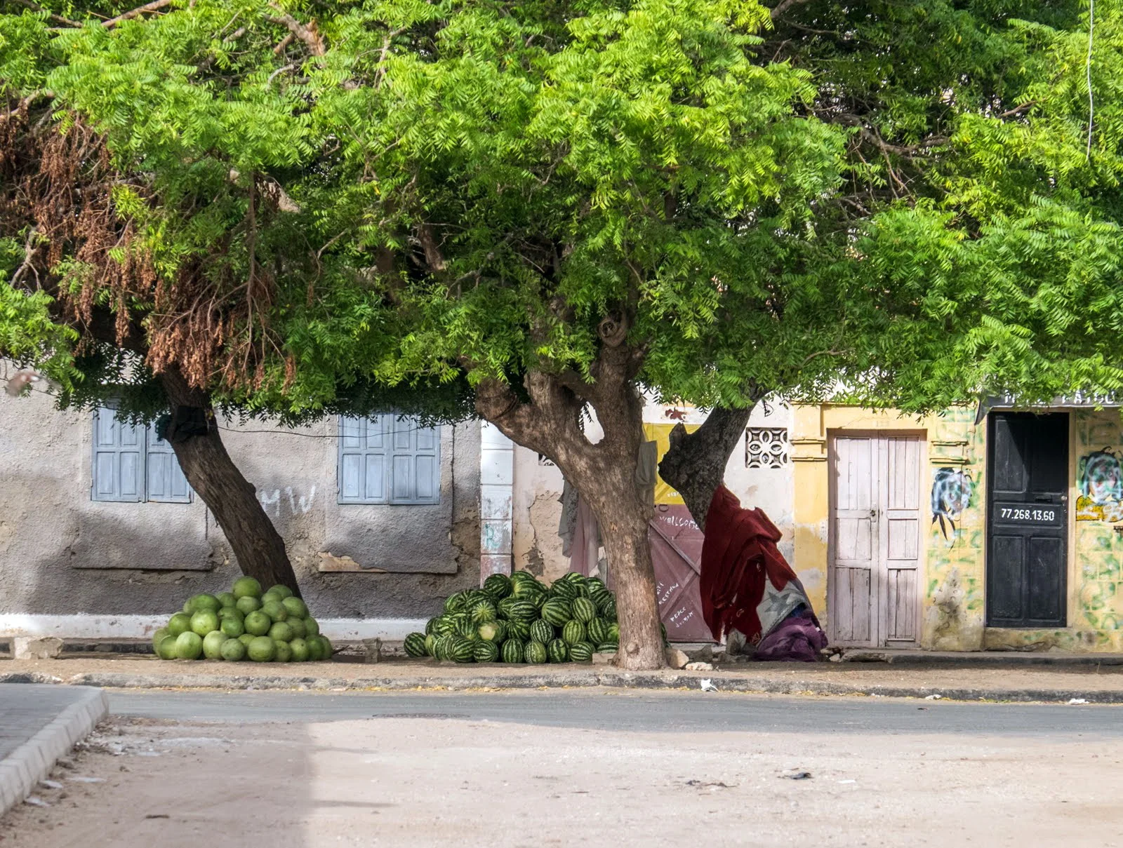 We were in Senegal at the height of the harvest season for many fruits and melons. It was common to see piles of watermelons along the roads and stacked on sidewalks, like the ones in the photo. Many of these fruit stands seemed to be unattended, I assume that buyers would select a melon and then pay the grower directly.