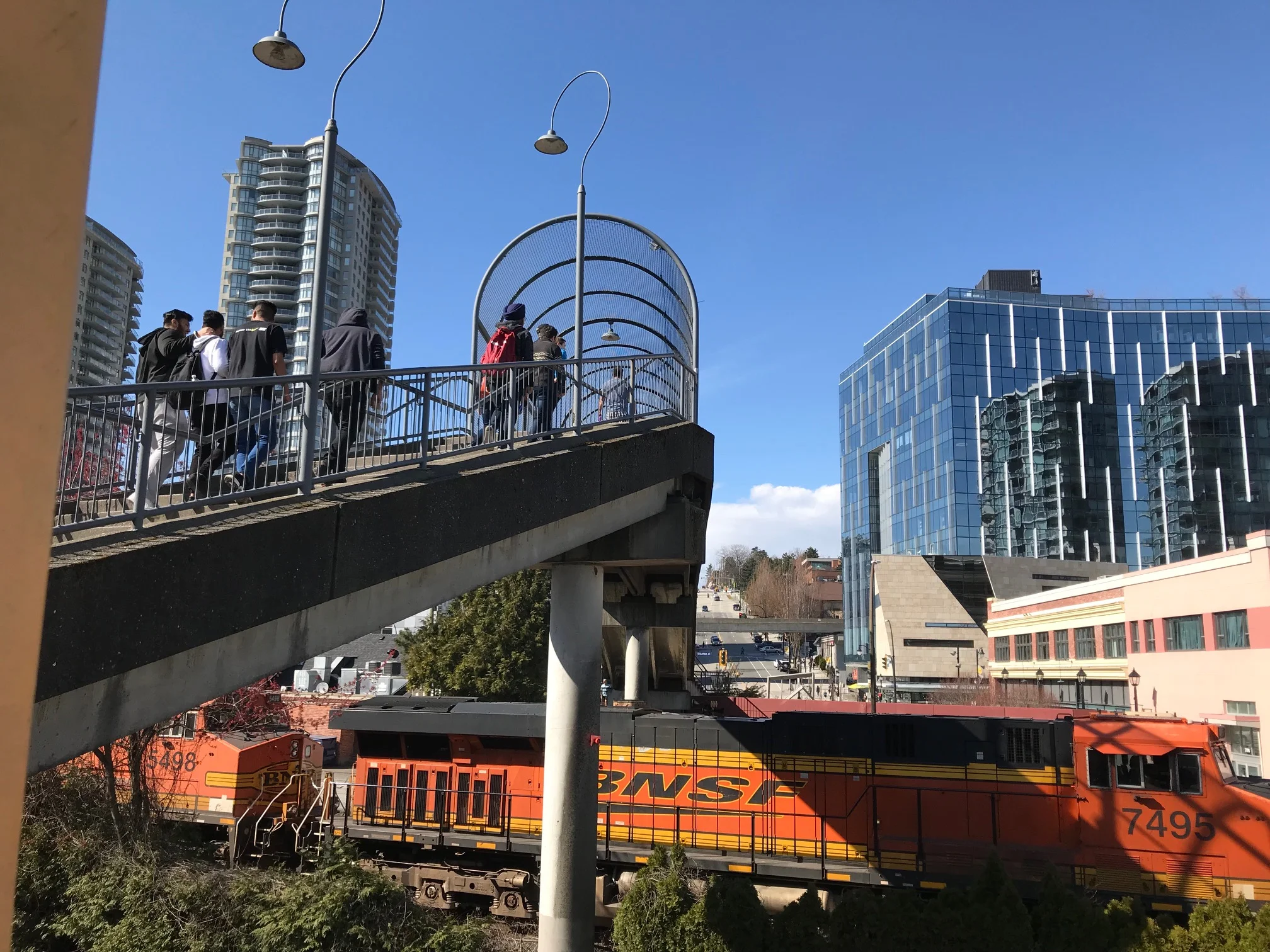 The New Westminster SkyTrain station is right next to heavy train tracks, like the south leg of Calgary’s LRT but they have managed to still create urban village next to the tracks.