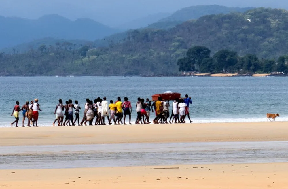 One afternoon we were surprised to see a funeral party and pallbearers trooping down the beach to a small village that had no road access. At least two streams had to be forded by the group, that prevented many of the guests from getting to the village to attend the burial.