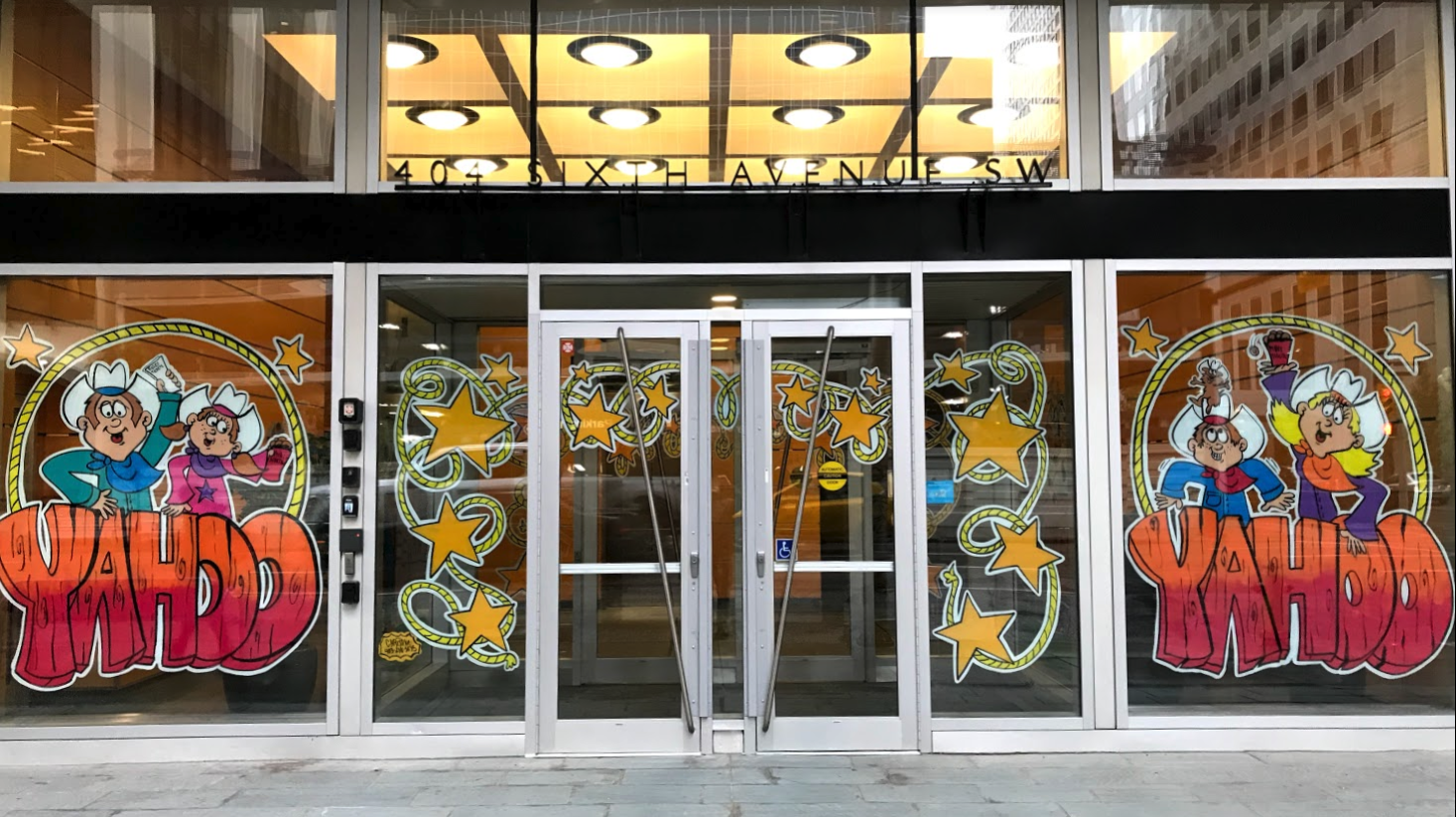 Only a few of the 100+ Calgary downtown office buildings have their entrances decorated to celebrate Stampede this year. It use to part of the Stampede tradition to create fun (and yes tacky for some) windows.